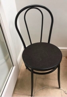 8 black bistro style chairs Image