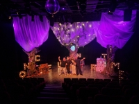 3 trees trunks, cottage, pink palace and gold lights/letters Image