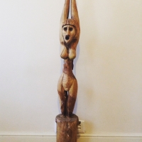 Old handcrafted women fetish statue Image